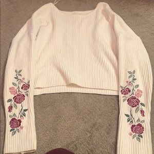 Cream sweater with flower design on sleeves